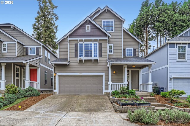 craftsman-style home with a garage, concrete driveway, and a porch
