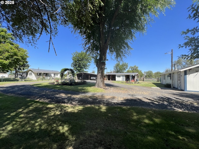 view of front of house with fence and a front lawn
