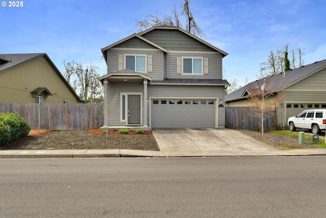 view of front facade with fence, a garage, and concrete driveway
