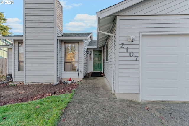 view of exterior entry featuring a garage