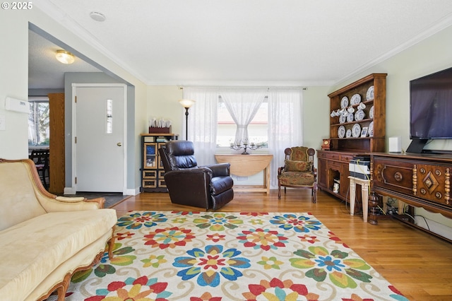 14996 SE Caruthers Ct, Portland, OR 97233 - living area featuring wood finished floors and crown molding
