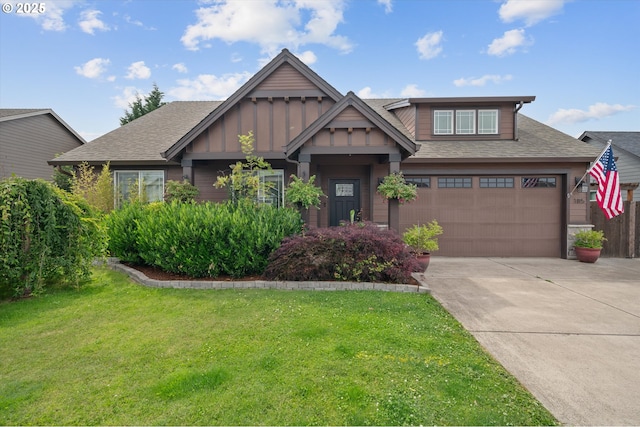 185 Lynx Ave, Aumsville, OR 97325 - view of front of property featuring concrete driveway, a front lawn, a shingled roof, and board and batten siding