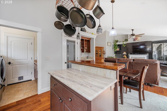 185 Lynx Ave, Aumsville, OR 97325 - kitchen featuring a ceiling fan, light wood finished floors, and hanging light fixtures