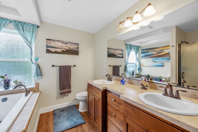 185 Lynx Ave, Aumsville, OR 97325 - full bathroom featuring double vanity, wood finished floors, a shower stall, and a bath