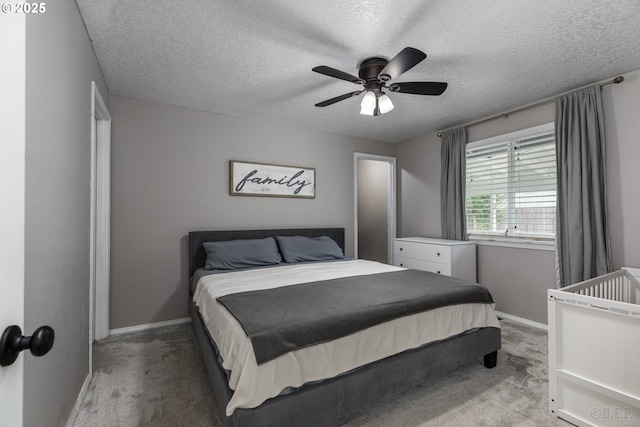 7364 SW 175th Ter, Beaverton, OR 97007 - bedroom with light carpet, baseboards, a textured ceiling, and a ceiling fan