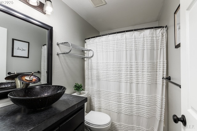 7364 SW 175th Ter, Beaverton, OR 97007 - bathroom with vanity, toilet, curtained shower, and a textured wall