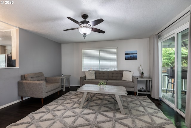 7364 SW 175th Ter, Beaverton, OR 97007 - living area with a textured ceiling, ceiling fan, dark wood finished floors, healthy amount of natural light, and baseboards
