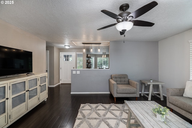 7364 SW 175th Ter, Beaverton, OR 97007 - living room with attic access, a textured ceiling, baseboards, dark wood-style flooring, and ceiling fan