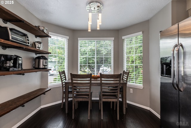 7364 SW 175th Ter, Beaverton, OR 97007 - dining space featuring baseboards, dark wood-style floors, and plenty of natural light