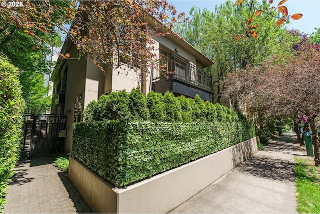 1951 NW Hoyt St, Portland, OR 97209 - view of property exterior featuring a gate and stucco siding