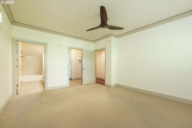 1951 NW Hoyt St, Portland, OR 97209 - unfurnished bedroom with light carpet, baseboards, a spacious closet, and connected bathroom