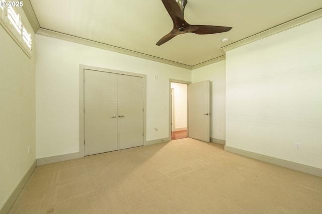 1951 NW Hoyt St, Portland, OR 97209 - unfurnished bedroom with light carpet, baseboards, a ceiling fan, and a closet