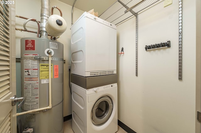 1951 NW Hoyt St, Portland, OR 97209 - laundry room with stacked washer and clothes dryer, water heater, and baseboards