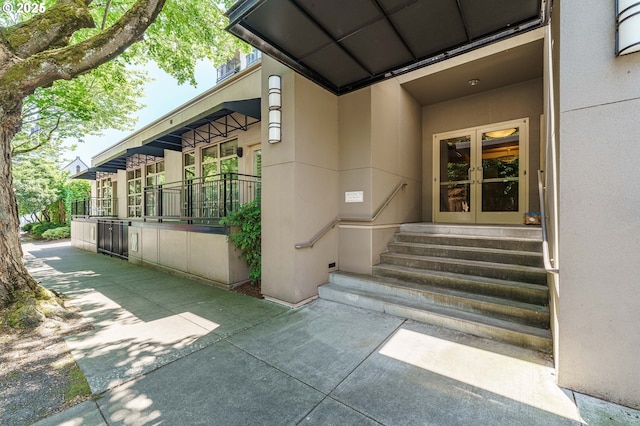 1951 NW Hoyt St, Portland, OR 97209 - property entrance with french doors and stucco siding