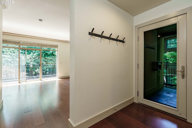 1951 NW Hoyt St, Portland, OR 97209 - doorway to outside with wood finished floors and baseboards
