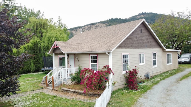 629 NE Johnson St, Myrtle Creek, OR 97457 - bungalow-style house with a trampoline, roof with shingles, and a mountain view