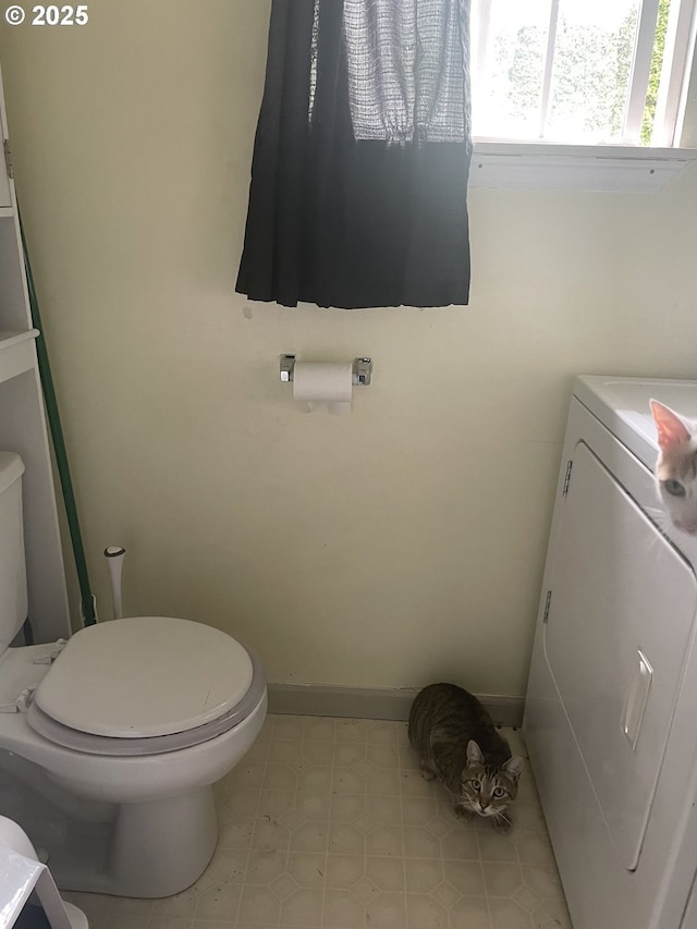 629 NE Johnson St, Myrtle Creek, OR 97457 - bathroom with washer / clothes dryer, toilet, baseboards, tile patterned floors, and vanity