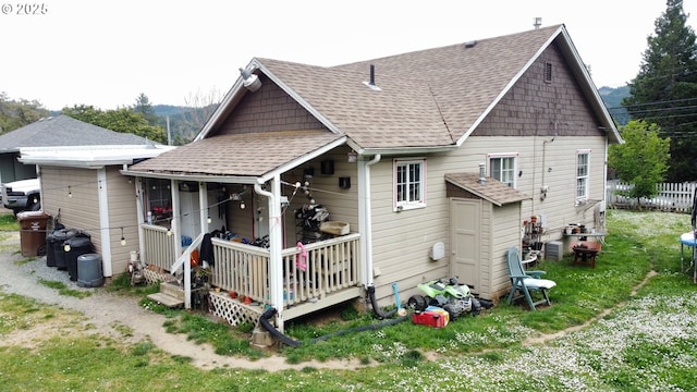 629 NE Johnson St, Myrtle Creek, OR 97457 - rear view of house featuring roof with shingles and a porch