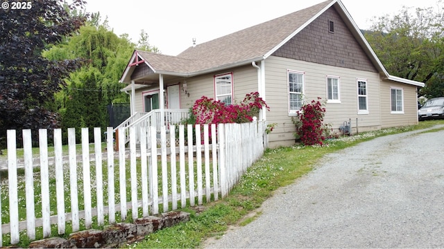 629 NE Johnson St, Myrtle Creek, OR 97457 - view of side of property featuring a shingled roof