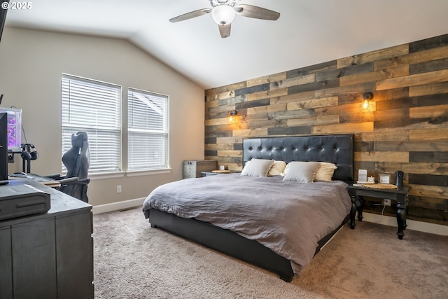 bedroom with wooden walls, baseboards, vaulted ceiling, and light carpet