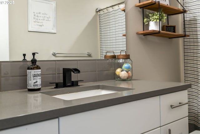 bathroom with vanity and backsplash