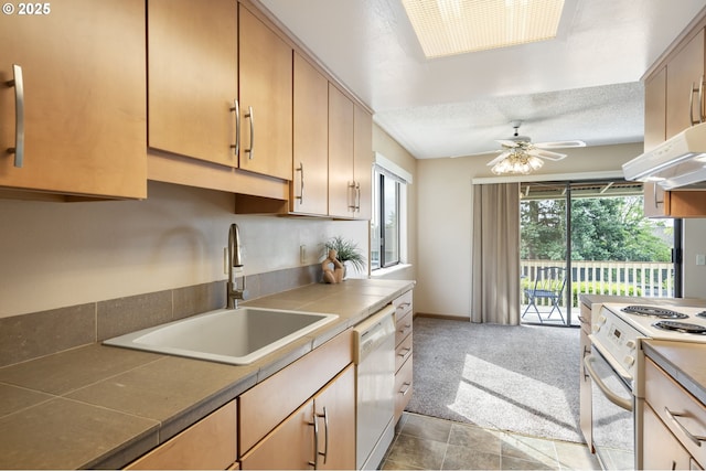 12110 SW King Arthur St, Portland, OR 97224 - kitchen featuring white appliances, tile counters, a ceiling fan, light colored carpet, and a textured ceiling