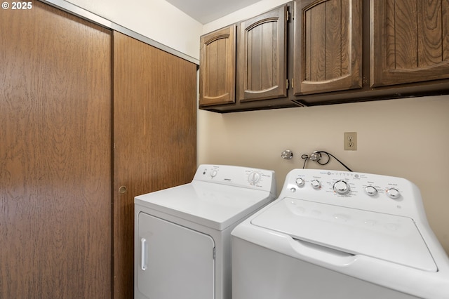 12110 SW King Arthur St, Portland, OR 97224 - laundry area featuring washing machine and clothes dryer and cabinet space