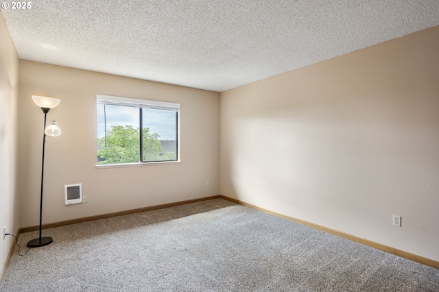 12110 SW King Arthur St, Portland, OR 97224 - empty room with carpet floors, heating unit, and a textured ceiling