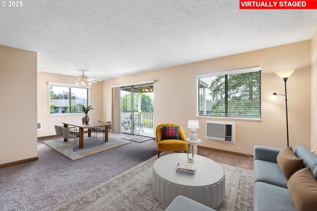 12110 SW King Arthur St, Portland, OR 97224 - carpeted living room featuring a textured ceiling, a wall mounted AC, and ceiling fan