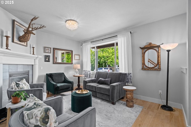 2733 NE 77th Pl, Portland, OR 97213 - living area featuring wood finished floors and a tile fireplace