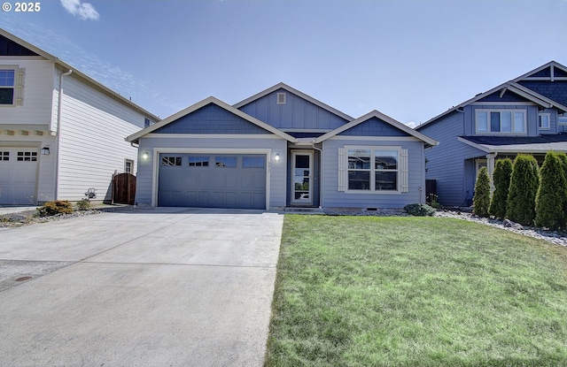 9817 NE 106th St, Vancouver, WA 98662 - view of front of home featuring board and batten siding, driveway, a front yard, and a garage