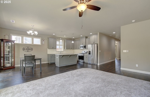 9817 NE 106th St, Vancouver, WA 98662 - kitchen featuring appliances with stainless steel finishes, light countertops, a breakfast bar, a center island, and recessed lighting