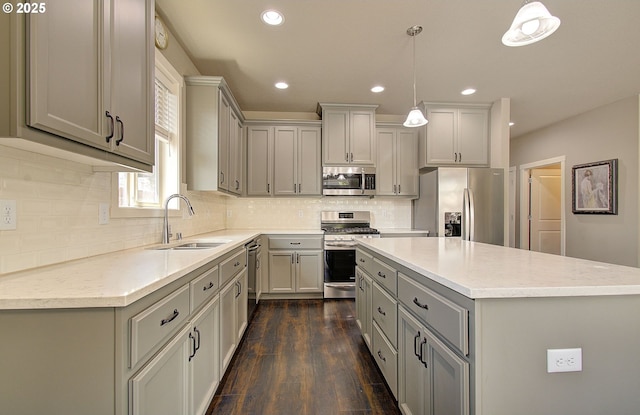 9817 NE 106th St, Vancouver, WA 98662 - kitchen with stainless steel appliances, gray cabinetry, dark wood-style flooring, recessed lighting, and light countertops