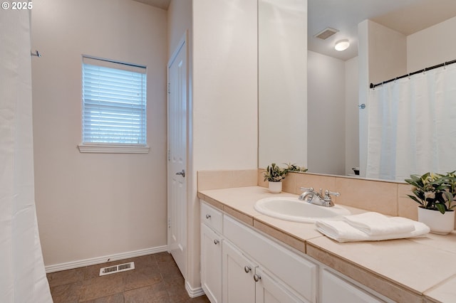 bathroom featuring vanity and tile patterned flooring