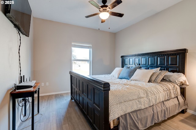 bedroom featuring wood-type flooring and ceiling fan