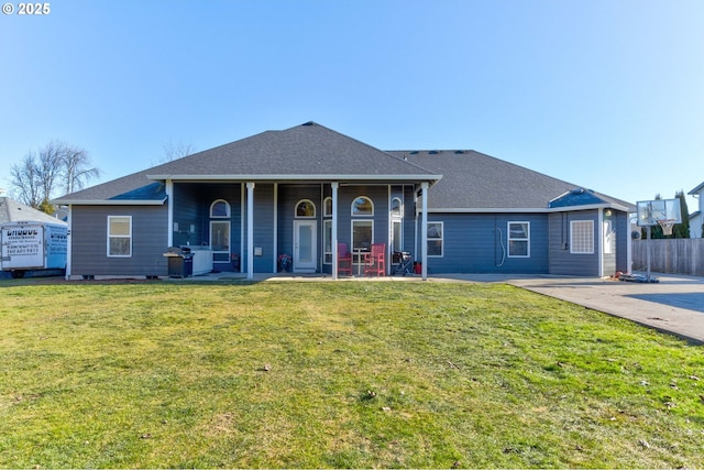 ranch-style home with a patio area and a front lawn