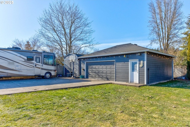 garage featuring a lawn