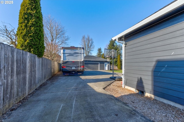 exterior space featuring an outbuilding and a garage