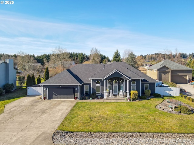 ranch-style home with a garage, a front yard, and a porch