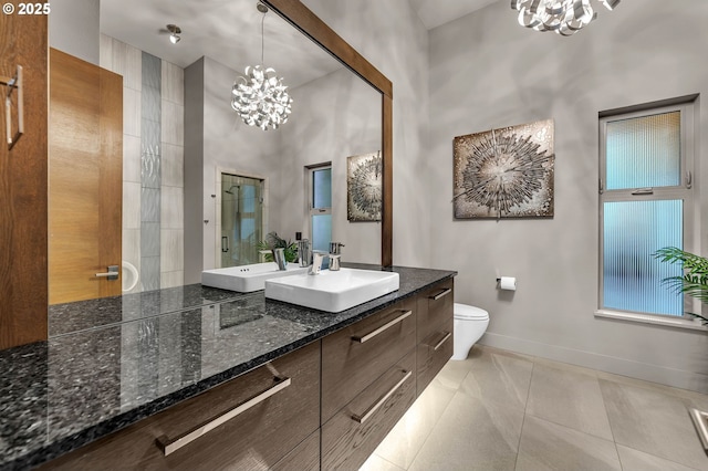 794 S A St, Washougal, WA 98671 - bathroom featuring a chandelier, double vanity, tile patterned flooring, and a tile shower