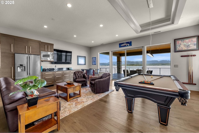 794 S A St, Washougal, WA 98671 - playroom featuring recessed lighting, light wood-style floors, healthy amount of natural light, billiards table, and a textured ceiling