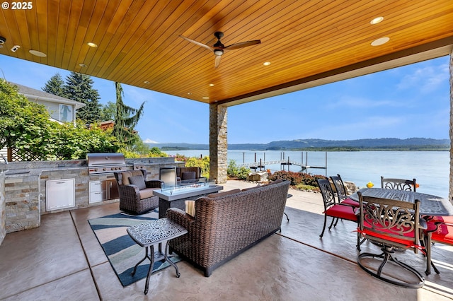 794 S A St, Washougal, WA 98671 - view of patio featuring an outdoor kitchen, a water view, ceiling fan, and outdoor dining area