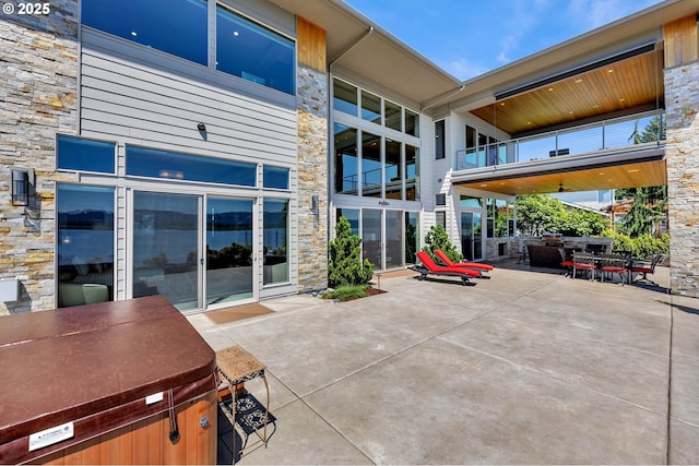 794 S A St, Washougal, WA 98671 - view of patio / terrace featuring a hot tub and outdoor dining area