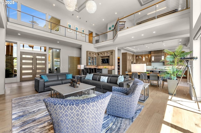 794 S A St, Washougal, WA 98671 - living room with a high ceiling, light wood-type flooring, recessed lighting, and a chandelier