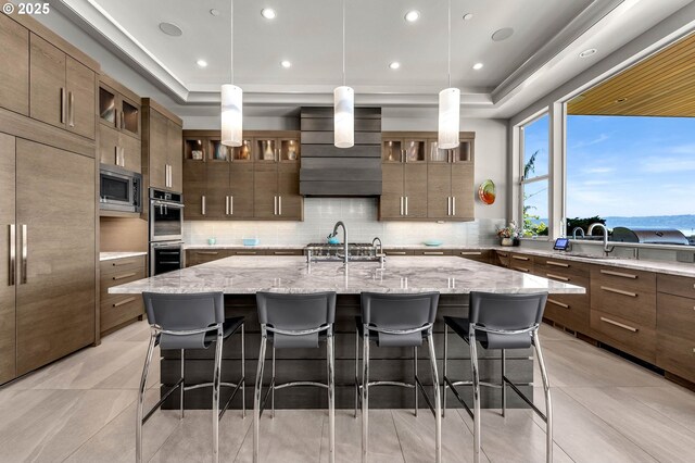 794 S A St, Washougal, WA 98671 - kitchen with stainless steel appliances, a raised ceiling, decorative backsplash, and recessed lighting