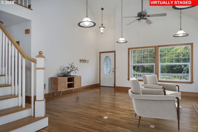 110 SW 61st St, South Beach, OR 97366 - foyer entrance with high vaulted ceiling, stairs, wood finished floors, ceiling fan, and baseboards