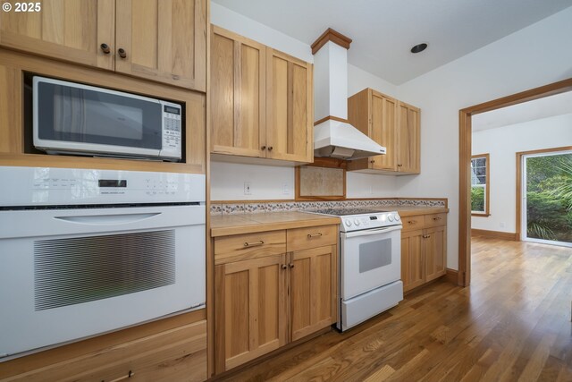 110 SW 61st St, South Beach, OR 97366 - kitchen featuring white appliances, range hood, dark wood finished floors, baseboards, and butcher block counters