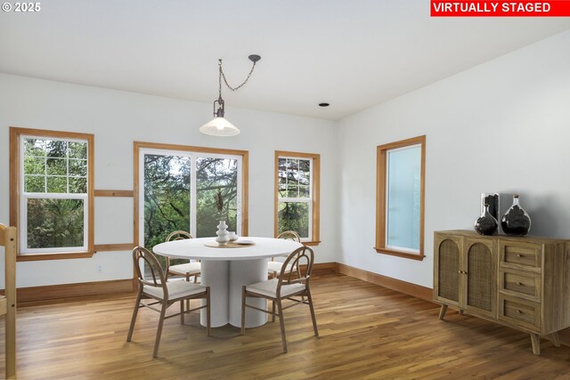 110 SW 61st St, South Beach, OR 97366 - dining space featuring wood finished floors, baseboards, and plenty of natural light