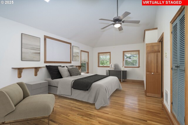 110 SW 61st St, South Beach, OR 97366 - bedroom featuring light wood-style flooring, high vaulted ceiling, a closet, and baseboards