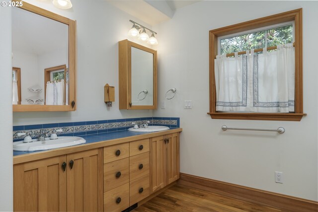 110 SW 61st St, South Beach, OR 97366 - full bath with double vanity, wood finished floors, and baseboards